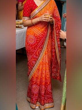 Red Flowing Women's Saree with Bandhani-Inspired Print